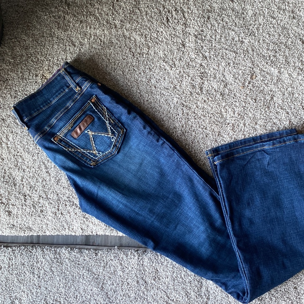 Brand new condition wrangler size 7 boot cut mid rise jeans worn one time only